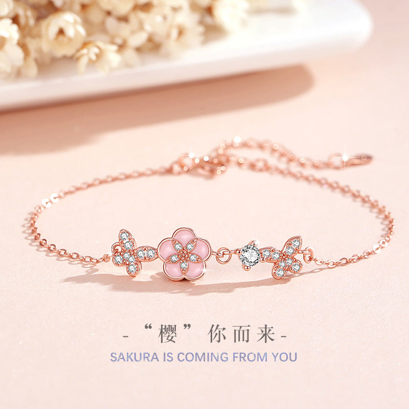 Armband aus 925er Sterlingsilber – Schmetterling und Pfirsichblüte und Zirkonia-Akzente
