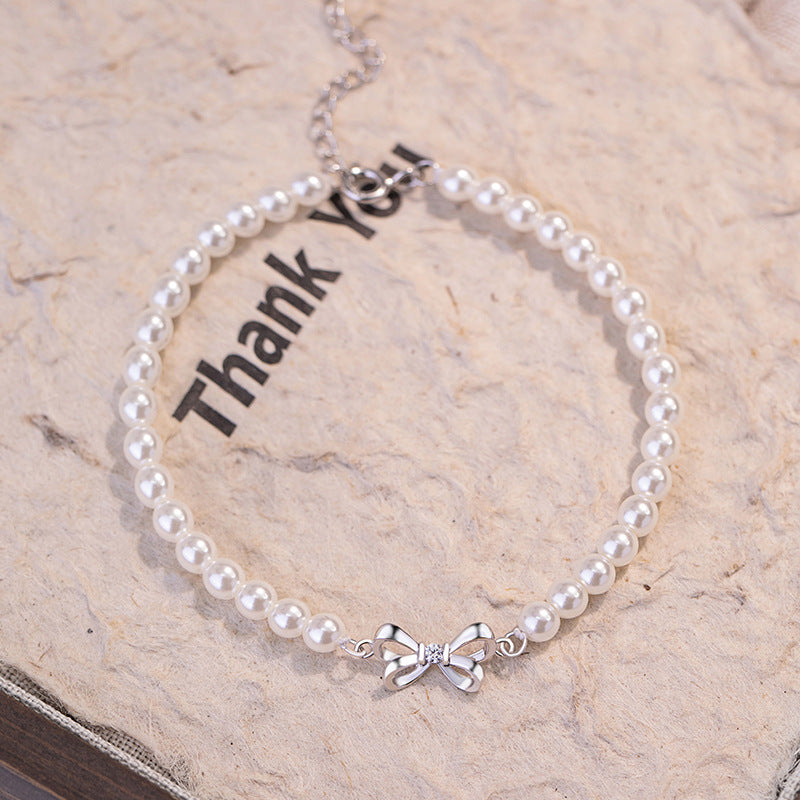 Armband aus 925er Sterlingsilber – Schleife und Perlendetail