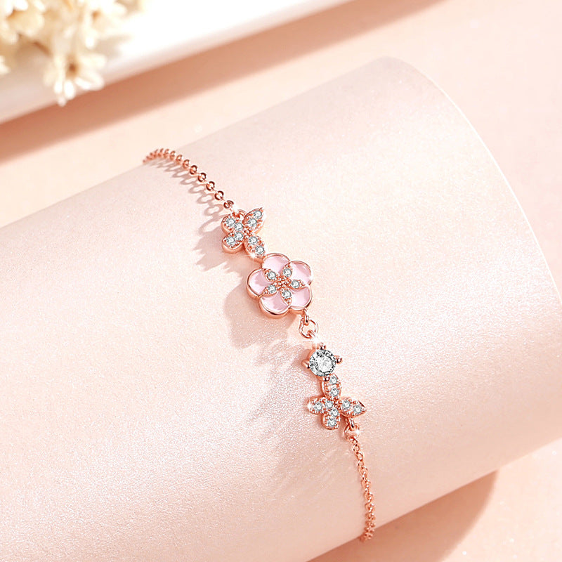 Armband aus 925er Sterlingsilber – Schmetterling und Pfirsichblüte und Zirkonia-Akzente