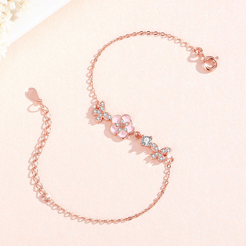 Armband aus 925er Sterlingsilber – Schmetterling und Pfirsichblüte und Zirkonia-Akzente