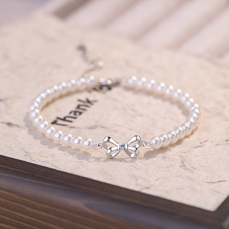 Armband aus 925er Sterlingsilber – Schleife und Perlendetail