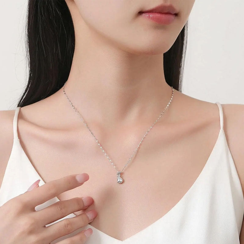 Naszyjnik ze srebra próby 999 – torebka i kokarda